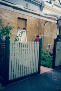 Terrace restoration with new picket fence and curved lattice side screens.