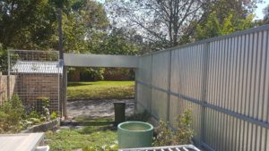 Fence all galvanised on a narrow poured concrete plinth. Nothing to do for many years.