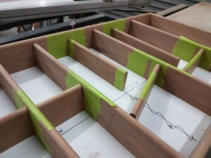 Drawer at glue up stage made in Ironbark. Tape is pulled once glued for a joint requiring no sanding.